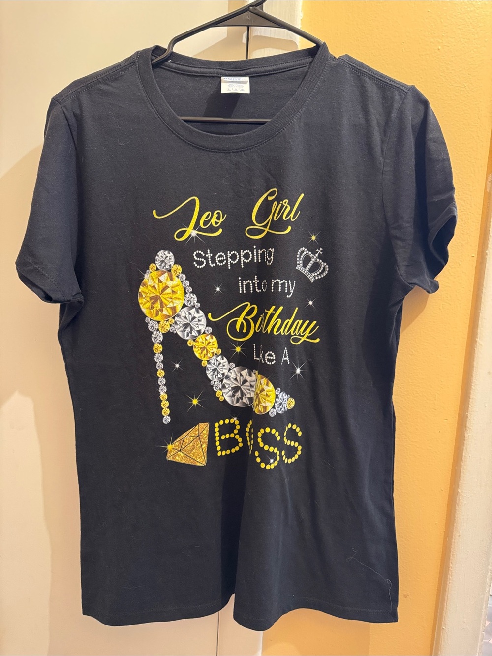 Port and Company Black Tee with Yellow and Silver Birthday Graphic - "Leo Girl"